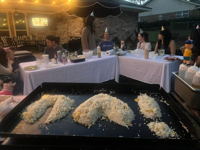 Hibachi birthday party for kids at home with a private chef cooking at a backyard family dinner