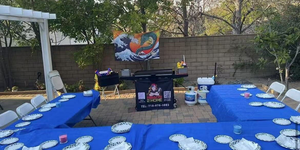 Private hibachi chef cooking on a portable grill for a Denver CO Front Range backyard patio dinner