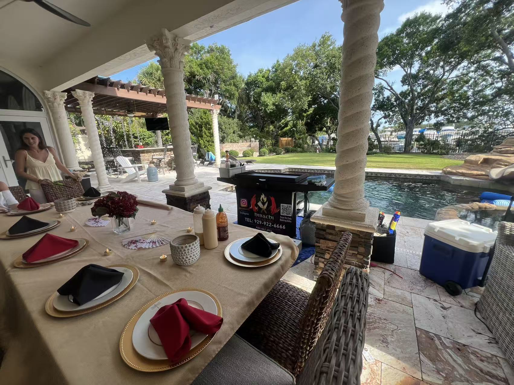 Covered patio hibachi at home setup with dining table and grill—ideal for Denver backyard catering