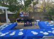 Hibachi 2 Home branded portable grill set up beside guest tables for a private backyard hibachi dinner at home